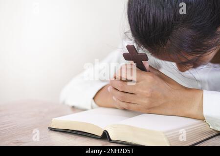 Religious young woman praying to God in the morning, spirtuality and religion, Religious concepts Stock Photo