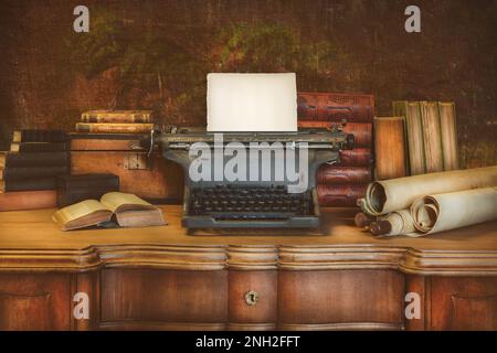 Old wooden desk with vintage typewriter holding an empty sheet of paper and ancient books and maps Stock Photo