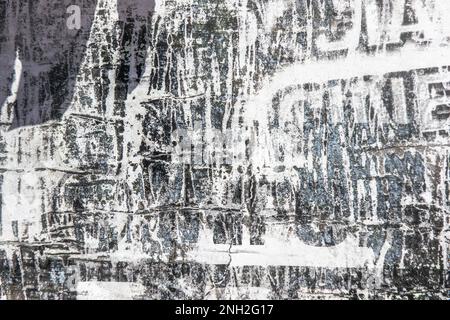 Old grunge torn collage urban street posters creased crumpled paper placard texture background. Ripped faded paper backdrop surface placard Stock Photo