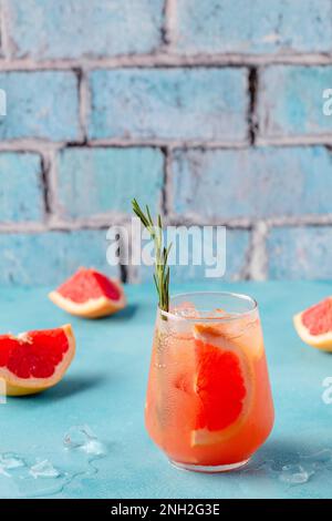 Cold lemonade/cocktail of fresh grapefruit juice, alcohol and ice cubes. Stock Photo