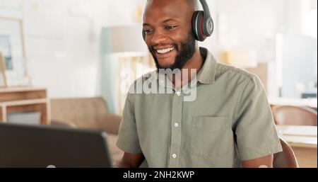 Laptop, headphones and black man on an online video call or meeting for his remote corporate job. Happy, talking and African guy on a webinar, video Stock Photo