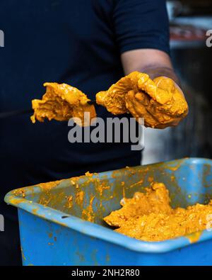 Prepping the chicken skew Kebab barbeque with marinated spices. Traditional Indian and Pakistan dish. Stock Photo