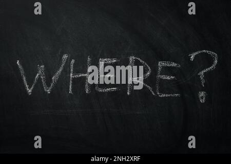 Where ? The word where written in chalk on a blackboard - one of the essential questions in journalism and communication Stock Photo