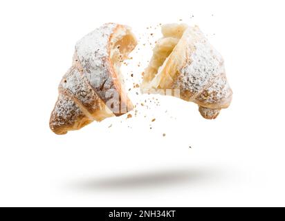 Croissant with sugar open in half floating on white background. Stock Photo