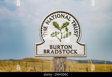 Burton Bradstock National Trust walking route sign on Jurassic coast, Dorset, England, UK Stock Photo
