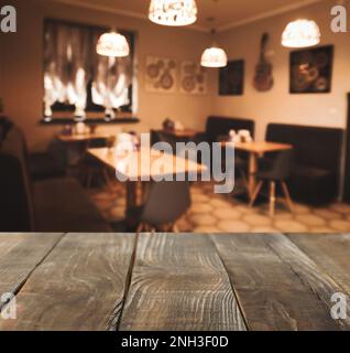 Empty wooden table in cafe. Bokeh effect Stock Photo