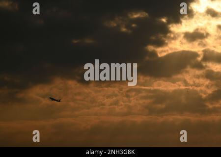 Silhouette of a passenger plane taking off from the airport Stock Photo
