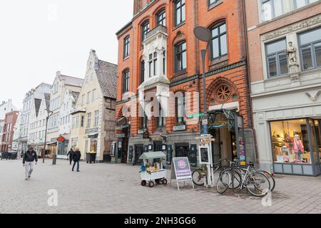 Flensburg, Germany - February 9, 2017: Ordinary people walk the Grosse Strasse, it is a central shopping street in Flensburg city Stock Photo