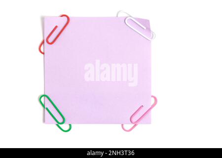 Lilac paper sticker for written notes and paper clips on a white background Stock Photo