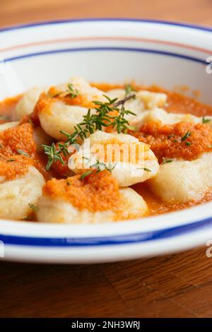 Home made celery root gnocchi with apple carrot Sauce Stock Photo