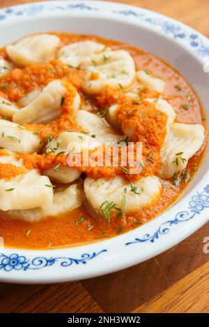 Home made celery root gnocchi with apple carrot Sauce Stock Photo