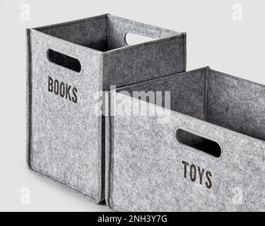 Two gray felt boxes for storing toys and books Stock Photo