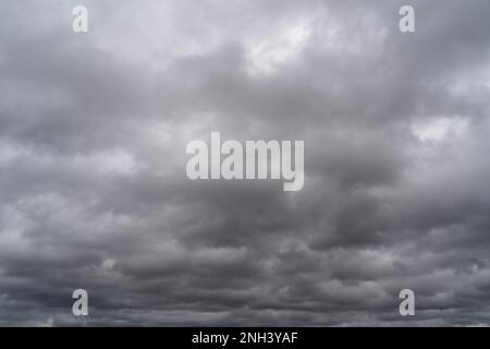 Background with dark and gray cloudy sky in spring Stock Photo