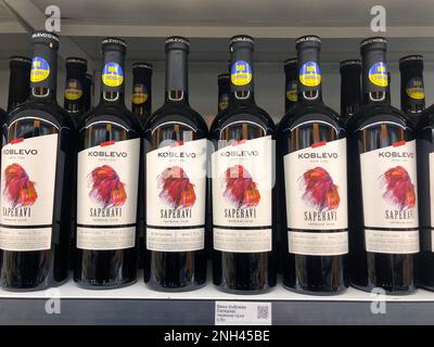 07.02.2023, Ukraine, Kharkiv, a large selection of wines of different varieties on the supermarket shelf. Ukrainian red wine Stock Photo