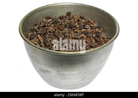 cocoa nibs in an aluminum bowl isolated on white background Stock Photo