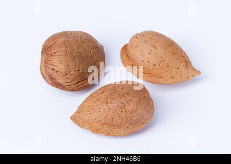 Three Almond nuts on a white background Stock Photo