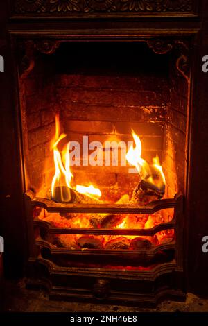 A lovely warm glow from a Victorian real open fire Stock Photo