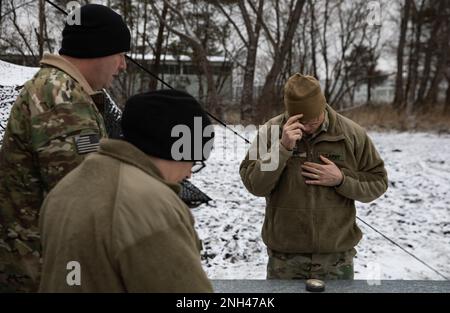 U.S. Army Lt. Col. Rich West, the 1st Infantry Division chaplain (1 ID), says a prayer before offering communion for Soldiers during a command post exercise held in Bolesławiec, Poland, Dec. 12, 2022. The 1 ID is working alongside NATO allies and regional security partners to provide combat-credible forces to V Corps, America’s forward deployed corps in Europe. Stock Photo