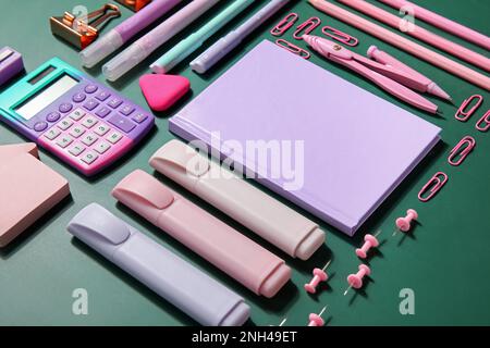 Composition with different stationery on green blackboard, closeup. Pi Day celebration Stock Photo