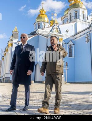 Kyiv, Ukraine. 20th Feb, 2023. U.S. President Joe Biden, left, is escorted by Ukrainian President Volodymyr Zelenskyy, right, to the Wall of Remembrance for the victims of the Russian invasion outside St. Michaels Golden-Domed Cathedral, February 20, 2023 in Kyiv, Ukraine. Biden stopped in Kiev on an unannounced visit to renew American support for Ukraine. Credit: Adam Schultz/White House Photo/Alamy Live News Stock Photo