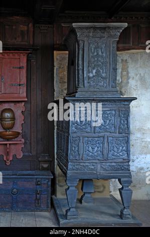 Tiled stove, early 17th century, in the upper Schultheissenhof, 1554, Franconian Open Air Museum, Bad Windsheim, Middle Franconia, Bavaria, Germany Stock Photo