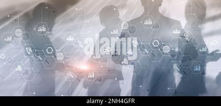 Diagrams and icons on hologram screen. Background with silhouettes Stock Photo