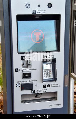 Rhoose, Wales - November 2022: Close up view of a self service rail ticket machine on the platform of Rhoose railway station. Stock Photo