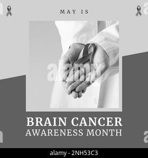 Composition of brain cancer awareness month text over doctor holding ribbon on grey background. Brain cancer awareness month concept digitally generat Stock Photo