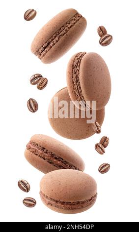 Macaroons and coffee beans levitation isolated on white background Stock Photo