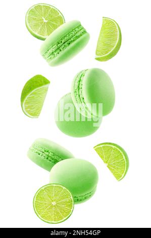 Macaroons and pieces of lime fruit levitation isolated on white background Stock Photo