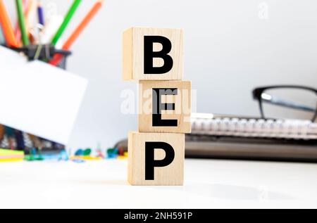 Word BEP. Wooden small cubes with letters isolated on blur background with copy space available. Business Concept image. Stock Photo