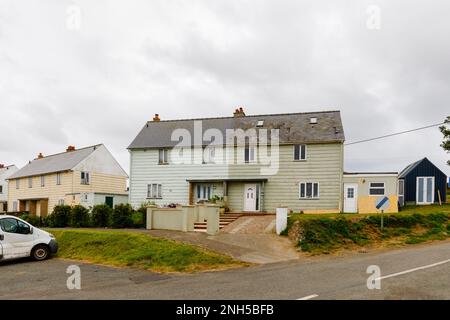 Semi-detached timber clad houses in Marloes, a small village on the Marloes Peninsula in the Pembrokeshire Coast National Park, west Wales Stock Photo