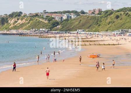 BOURNEMOUTH, UK - July 08, 2022. Man jogging on the beach in summer. Bournemouth, Dorset, UK Stock Photo