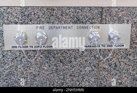 Fire department connectors on building, Calgary, 2 Street SW, Alberta, Canada Stock Photo
