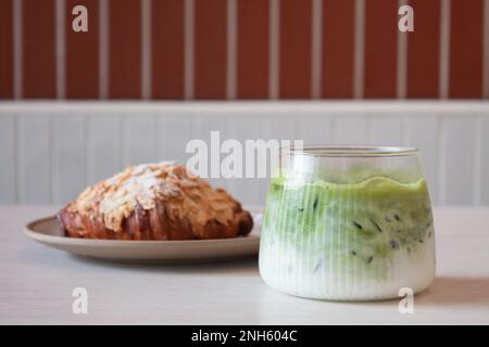 ce matcha green tea served with croissant, stock photo Stock Photo