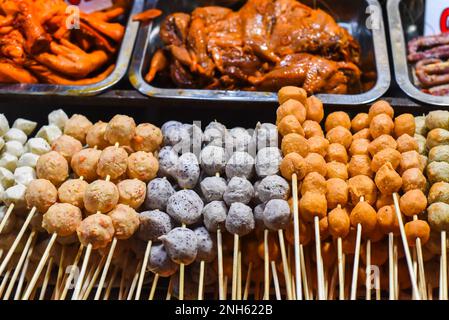 Many snacks and seafood in vietnamese night market in Da Lat Stock Photo
