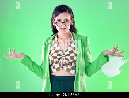 Confused, anger and portrait of a teacher with paper isolated on a green background in a studio. Anxiety, tired and trendy woman with edgy and Stock Photo