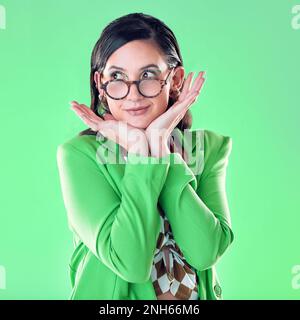 Woman teacher in medical face mask shows silence sign gesture on studio ...