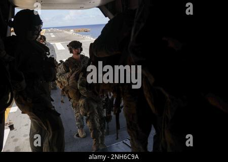 PACIFIC OCEAN (July 19, 2022) U.S. Marines assigned to Battalion Landing Team 3rd Battalion, 4th Marine Regiment, Marine Air-Ground Task Force 7, board a U.S. Marine Corps   MV-22 Osprey aboard U.S. Navy Wasp-class amphibious assault ship USS Essex (LHD 2) , in support of Rim of the Pacific (RIMPAC) 2022, July 19. Twenty-six nations, 38 ships, three submarines, more than 170 aircraft and 25,000 personnel are participating in RIMPAC 2022 from June 29 to Aug. 4 in and around the Hawaiian Islands and Southern California. The world’s largest international maritime exercise, RIMPAC 2022 provides a Stock Photo