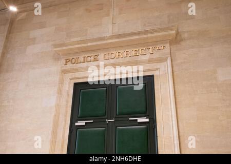 police correctionnelle text on ancient wall facade building means in french justice Criminal Court courtroom Stock Photo
