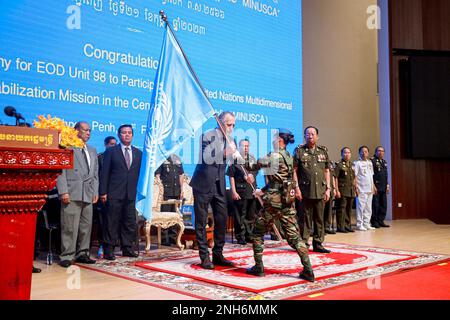 Phnom Penh, UN flag to a Cambodian peacekeeper in Phnom Penh. 21st Feb, 2023. Joseph Scheuer (C), United Nations resident coordinator to Cambodia, hands over a UN flag to a Cambodian peacekeeper in Phnom Penh, Cambodia on Feb. 21, 2023. Cambodia on Tuesday dispatched a new batch of 98 peacekeepers to join a United Nations peacekeeping operation in the war-torn Central African Republic, officials said. Credit: Ly Lay/Xinhua/Alamy Live News Stock Photo