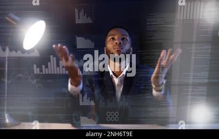 Businessman, research data and confused at night in office, waiting for stock market. Black man with open hands thinking about mistake with graphs and Stock Photo