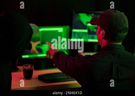Hackers making cryptocurrency fraud using virus software Stock Photo