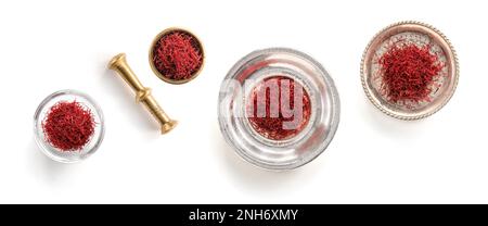 High-Quality Saffron isolated in 4 different containers: silver, brass, glass. with mortar and pestle Stock Photo