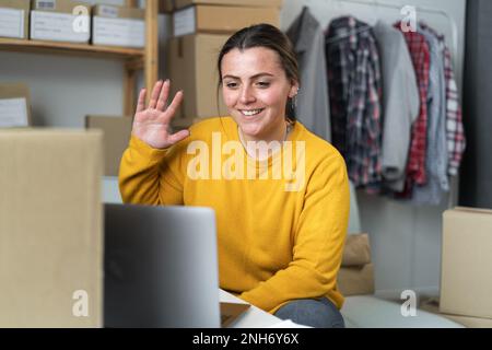 Starting small businesses SME owners female entrepreneurs taking online order using laptop webcam. Sell to customers, SME business ideas online. Copy Stock Photo