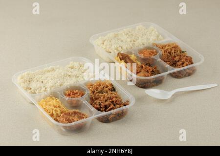 Nasi Uduk Take Away Food Concept, Indonesian Nasi Lemak with Various Side Dish Popular for Breakfast Stock Photo