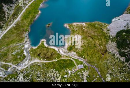 Lake Pian Palù, with its unmistakable emerald-coloured waters,Sole Valley, Trento province, Stelvio National Park, Trentino Alto Adige, northern Italy Stock Photo