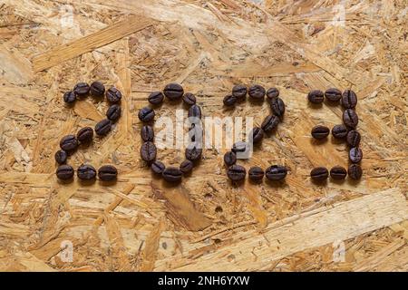 2023 from roasted coffee beans on wooden background Stock Photo