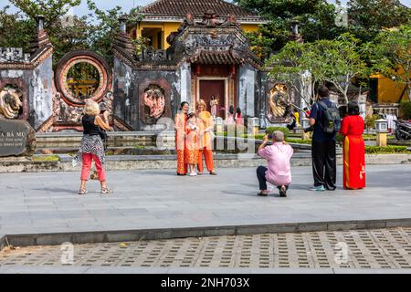 Tourists taking family photos at Ba Mu Temple, Vietnam. Stock Photo