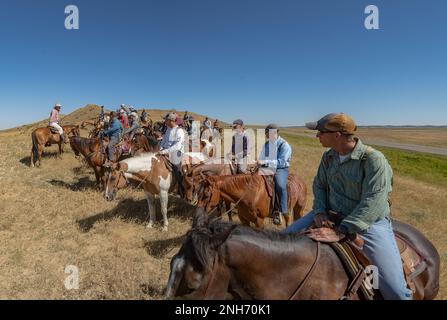 Maj. Gen. David Hodne, commanding general of the 4th Infantry Division, and fellow leaders ride horses assigned to the Mounted Color Guard from the 4th Inf. Div. on July 20, 2022, at Little Bighorn, Montana. This cavalry ride was a part of the Division Leaders Academy, a training event for senior enlisted officers. Stock Photo